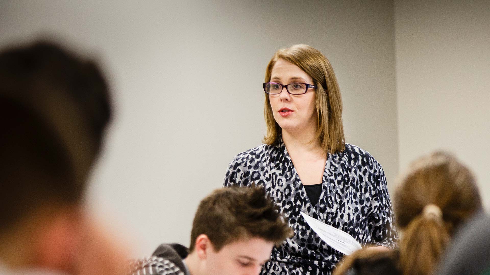 Students direct their attention towards their professor as she lectures. 
